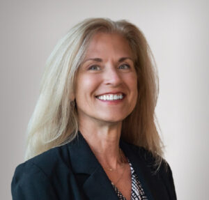 Pamela Statz headshot on a grey background